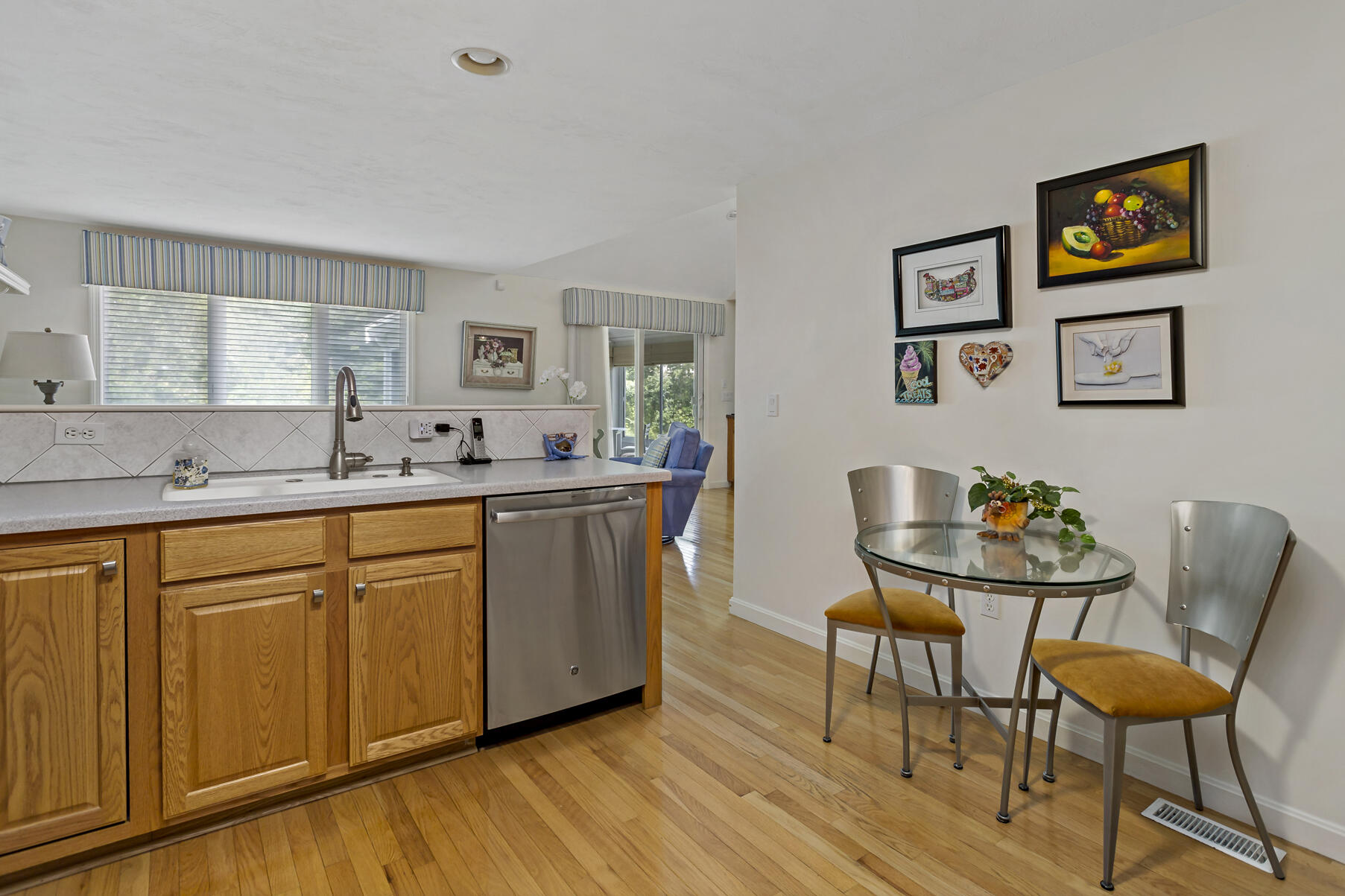 8 Chippers Lane Mashpee, MA 02649 - Photo 6 of 36 a kitchen with stainless steel appliances granite countertop a sink and a refrigerator