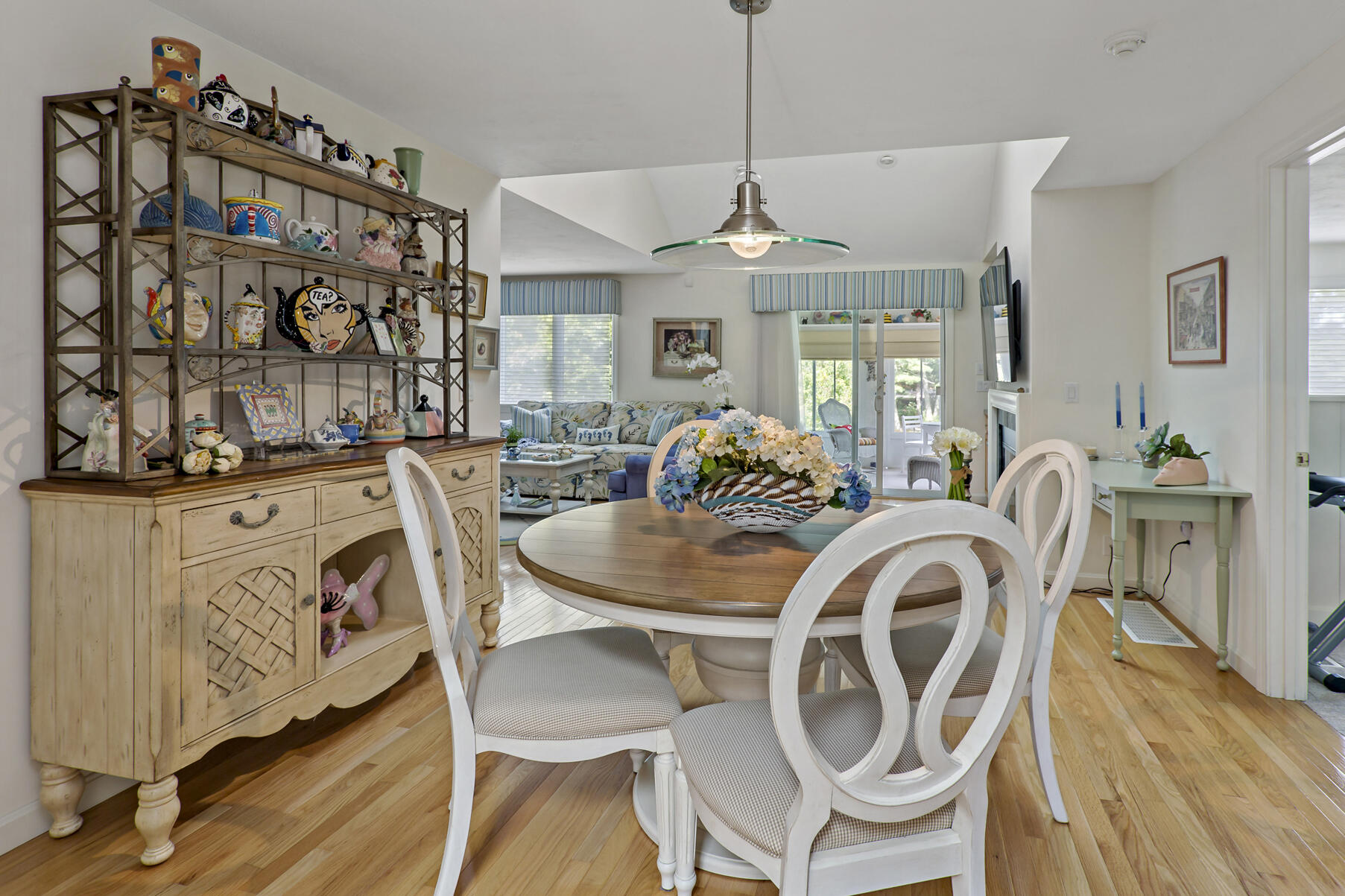 8 Chippers Lane Mashpee, MA 02649 - Photo 10 of 36 a dining room with furniture a chandelier and wooden floor