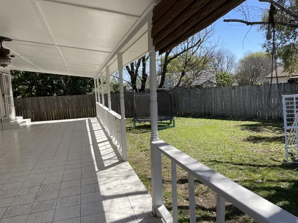 a view of swimming pool with a patio