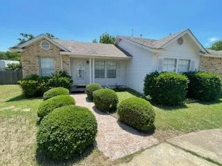 front view of a house with a yard