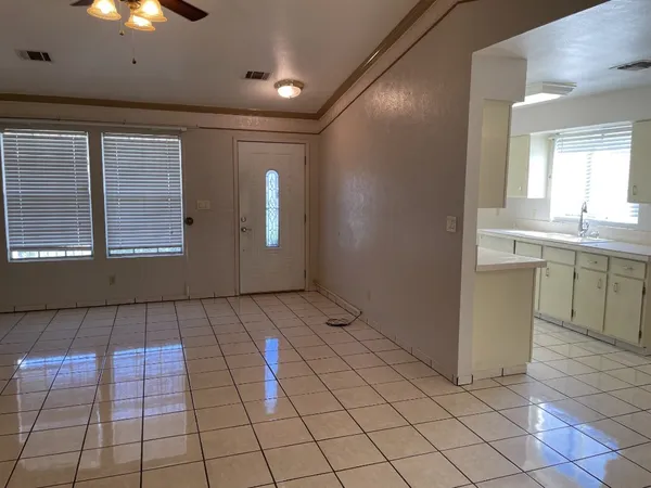 a view of a kitchen with windows