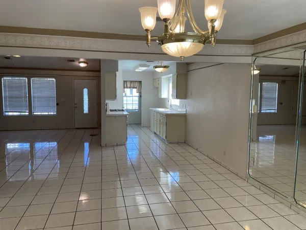 a view of a lobby with furniture and chandelier