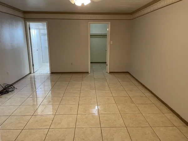 a view of an empty room and window