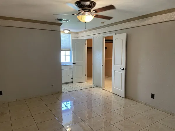 a view of an empty room with a window