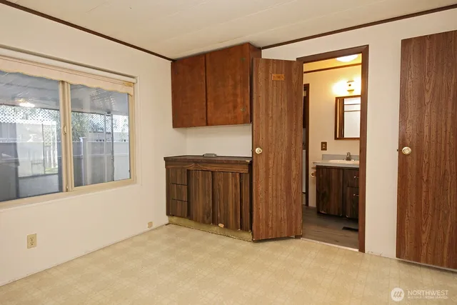 a view of an empty room with a window