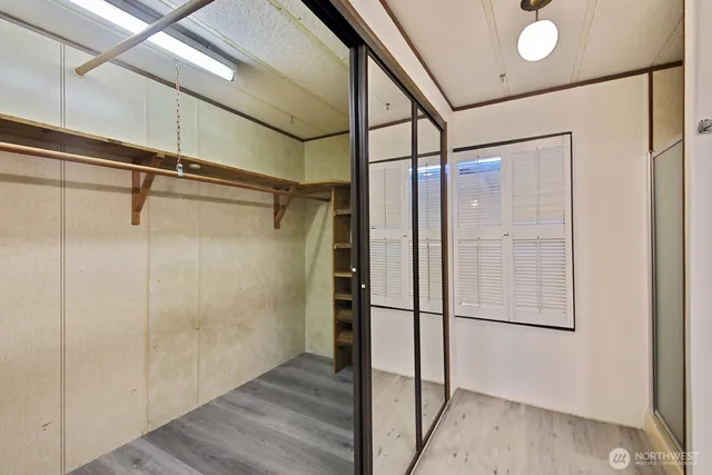 a bathroom with a glass shower door