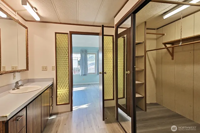 a bathroom with a shower and a sink