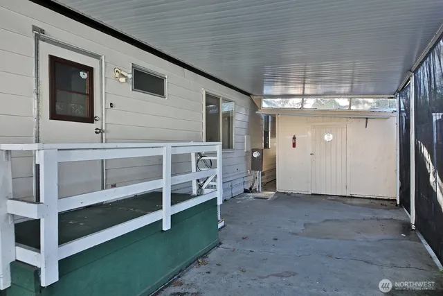 a view of an empty room with a fireplace