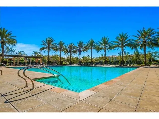 a view of swimming pool with outdoor seating and yard