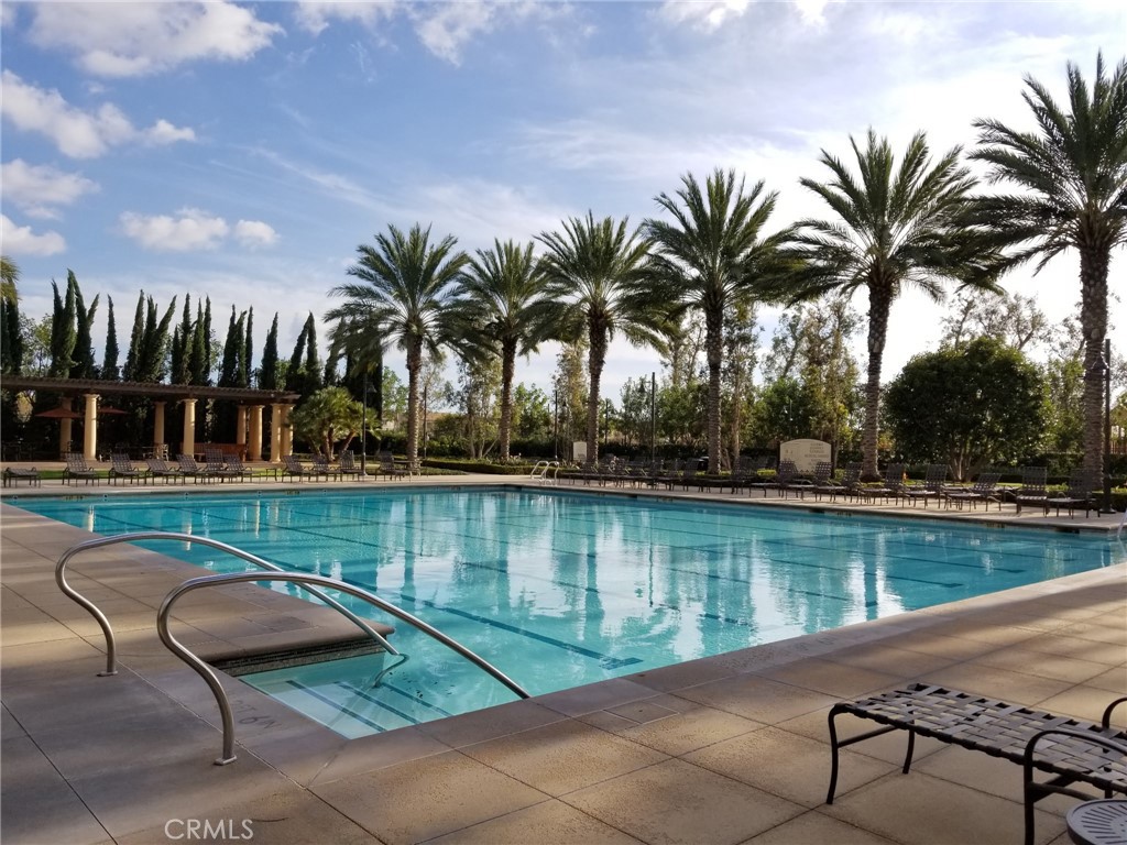 74 Rose Arch Irvine, CA 92620 - Photo 21 of 21 a view of swimming pool with outdoor seating and lake