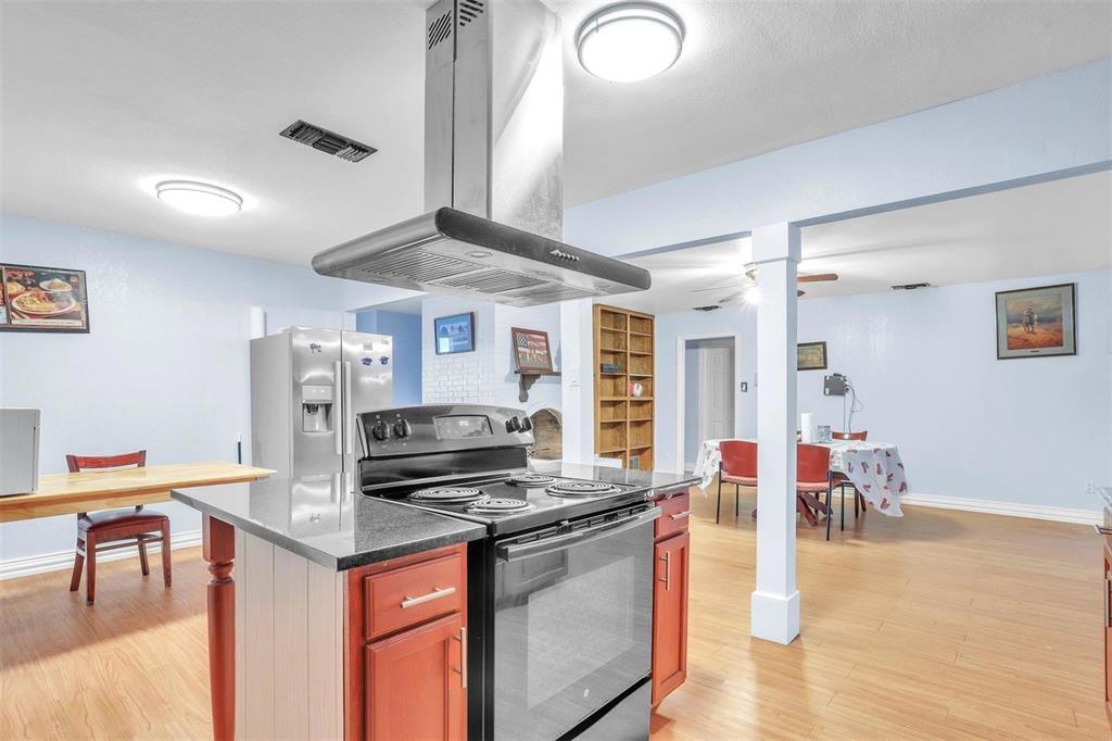 3226 Barnes Bridge Road Dallas, TX 75228 - Photo 11 of 27 a kitchen with stainless steel appliances granite countertop a stove and a refrigerator