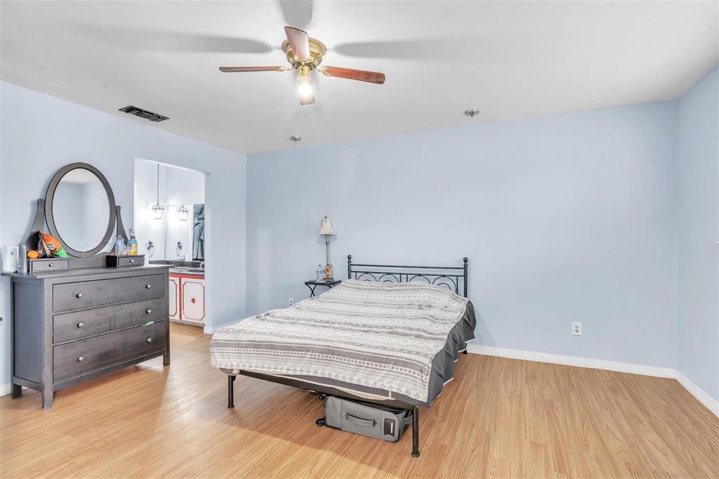 3226 Barnes Bridge Road Dallas, TX 75228 - Photo 12 of 27 a bedroom with a bed and a dresser
