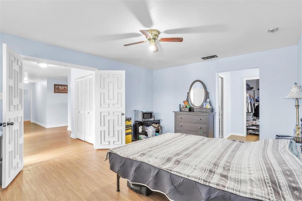 3226 Barnes Bridge Road Dallas, TX 75228 - Photo 13 of 27 a bedroom with a bed and a dresser
