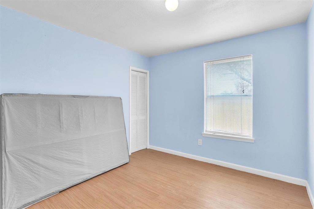 3226 Barnes Bridge Road Dallas, TX 75228 - Photo 21 of 27 an empty room with a window