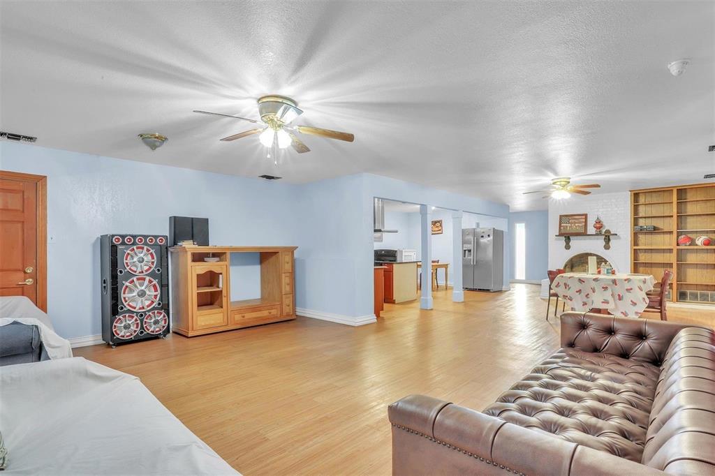 3226 Barnes Bridge Road Dallas, TX 75228 - Photo 5 of 27 a living room with furniture and kitchen view