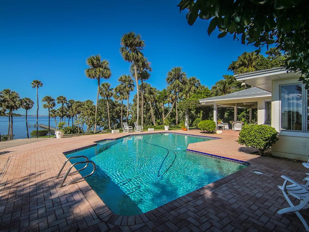 39 North River Road Stuart, FL 34996 - Photo 54 of 66 a view of a house with a swimming pool