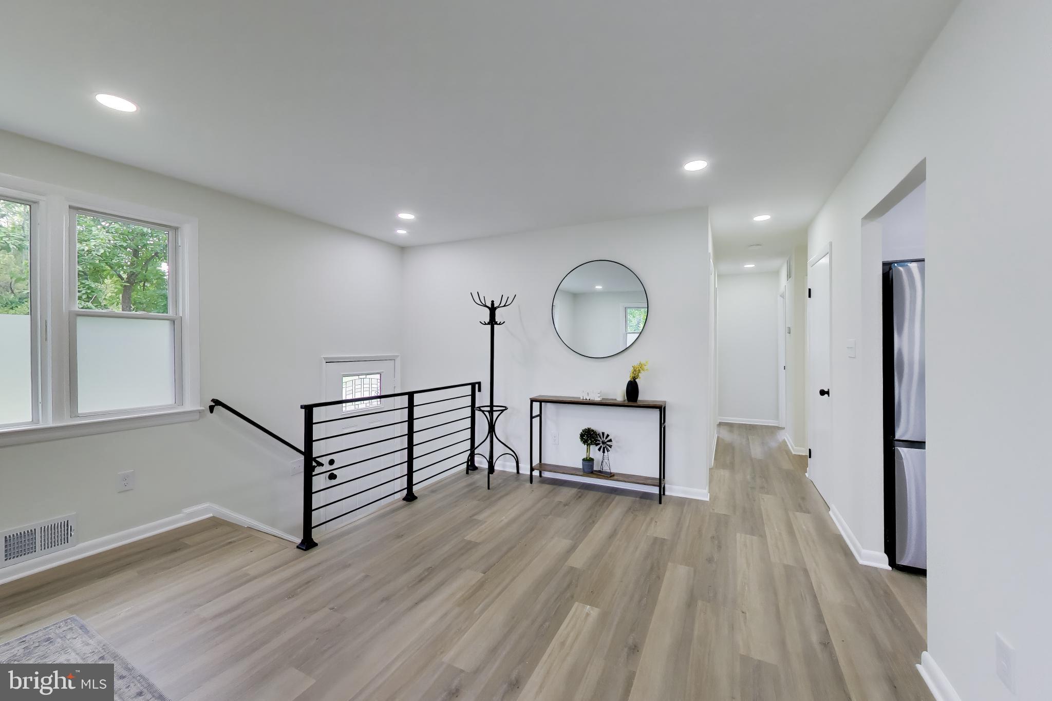 11309 Keystone Avenue Clinton, MD 20735 - Photo 12 of 36 a view of a livingroom with furniture and wooden floor