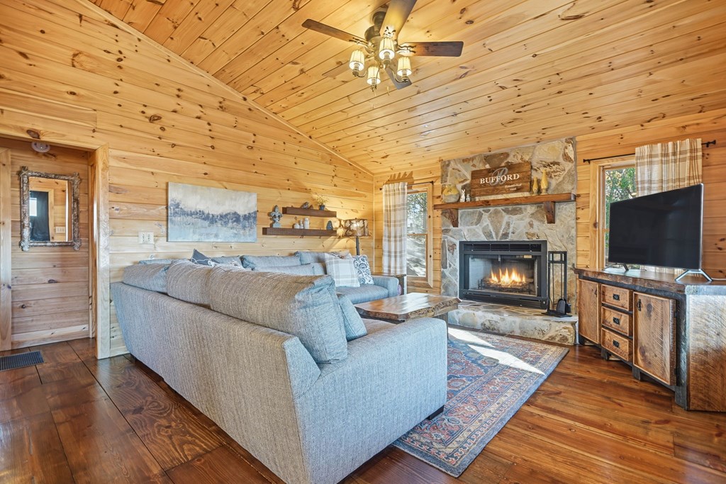 478 Cohutta Mountain Road Blue Ridge, GA 30513 - Photo 11 of 47 a living room with furniture and a fireplace