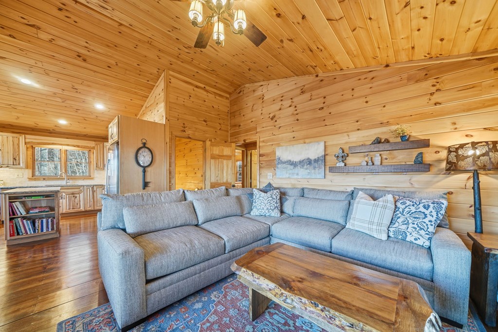 478 Cohutta Mountain Road Blue Ridge, GA 30513 - Photo 13 of 47 a living room with furniture and wooden floor