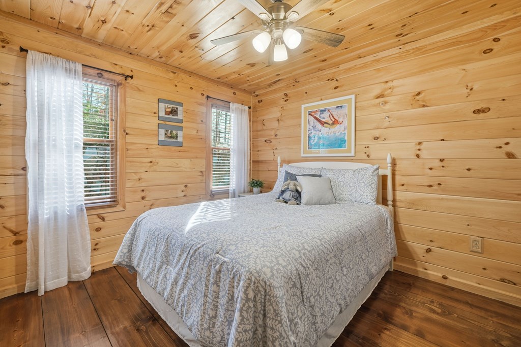 478 Cohutta Mountain Road Blue Ridge, GA 30513 - Photo 17 of 47 a bedroom with a bed and a window
