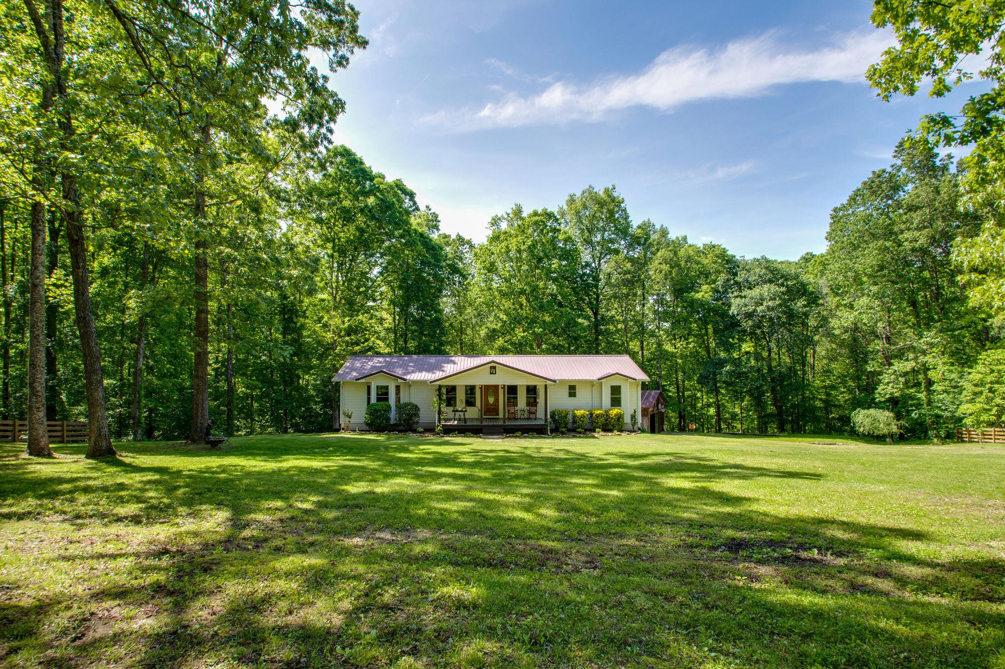 1017 Deer Ridge Road Kingston Springs, TN 37082 - Photo 2 of 29 a view of front of house with yard and green space