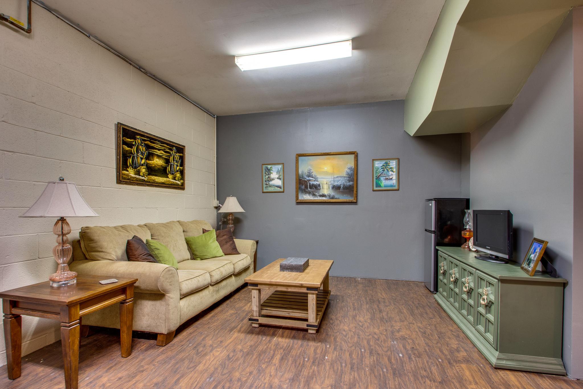 1017 Deer Ridge Road Kingston Springs, TN 37082 - Photo 23 of 29 a living room with furniture and a flat screen tv