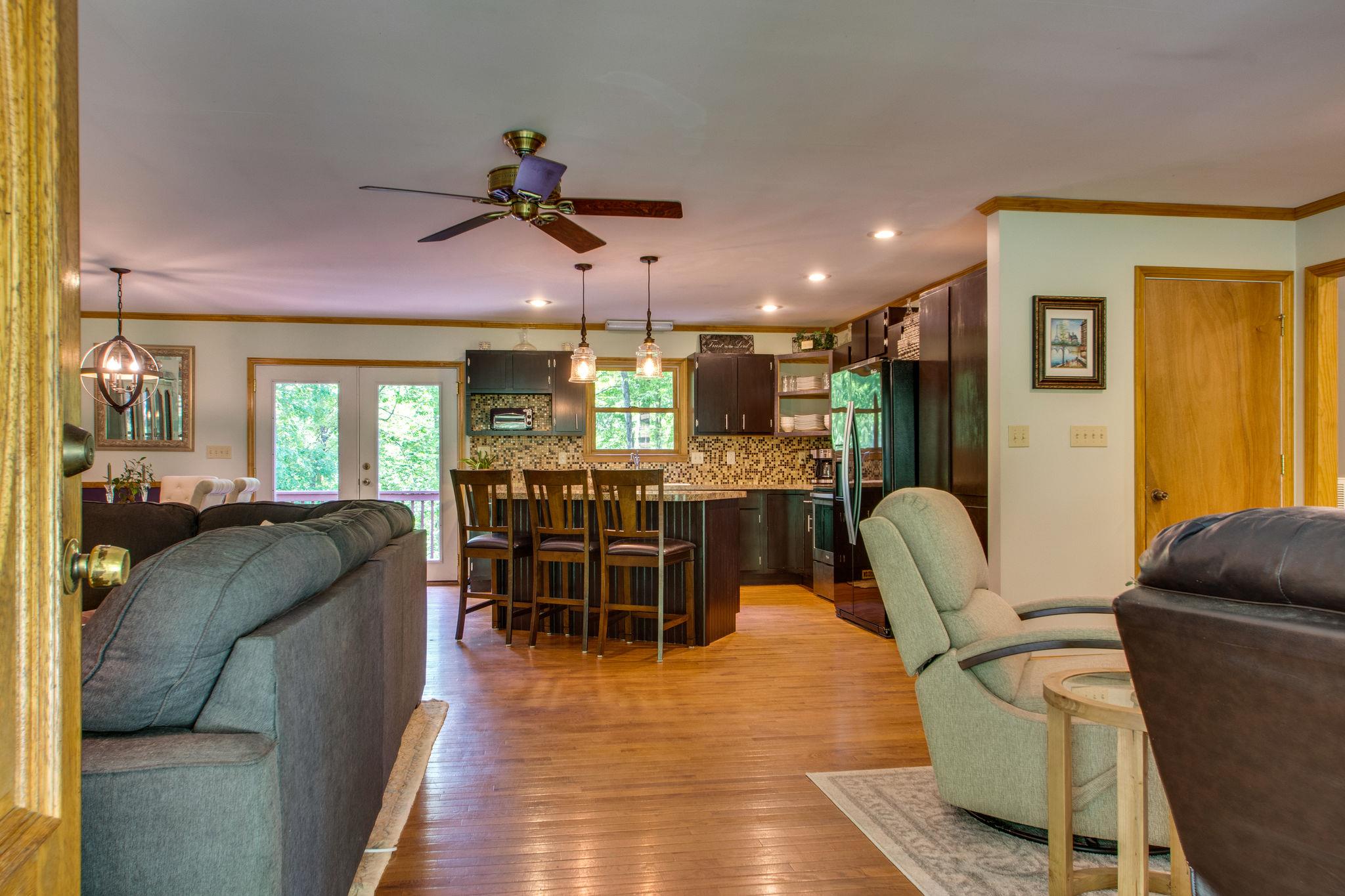 1017 Deer Ridge Road Kingston Springs, TN 37082 - Photo 6 of 29 a dining room with furniture and wooden floor
