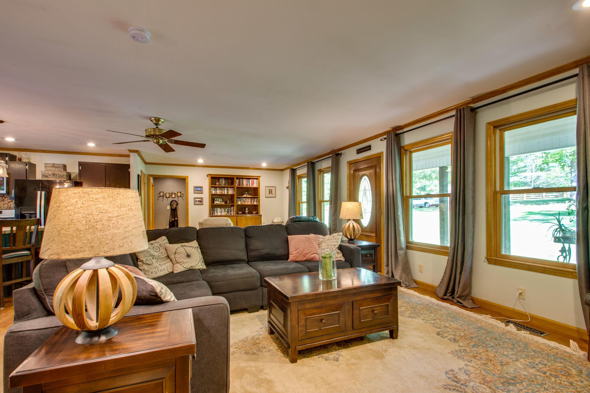 1017 Deer Ridge Road Kingston Springs, TN 37082 - Photo 9 of 29 a living room with furniture and a floor to ceiling window