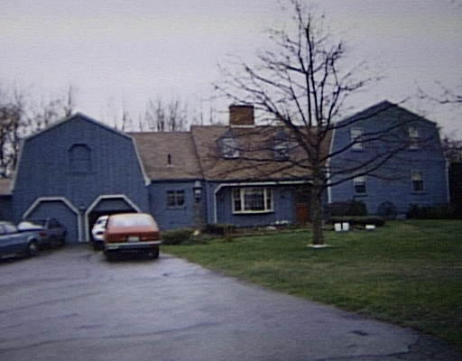 1248 Hill Road Littleton, MA 01460 - Photo 1 of 1 a car parked in front of a house
