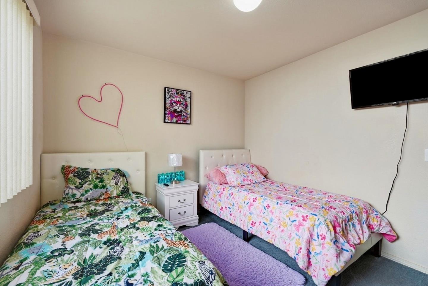 3882 Pintail Court Merced, CA 95340 - Photo 15 of 21 a bedroom with a bed and flat screen tv