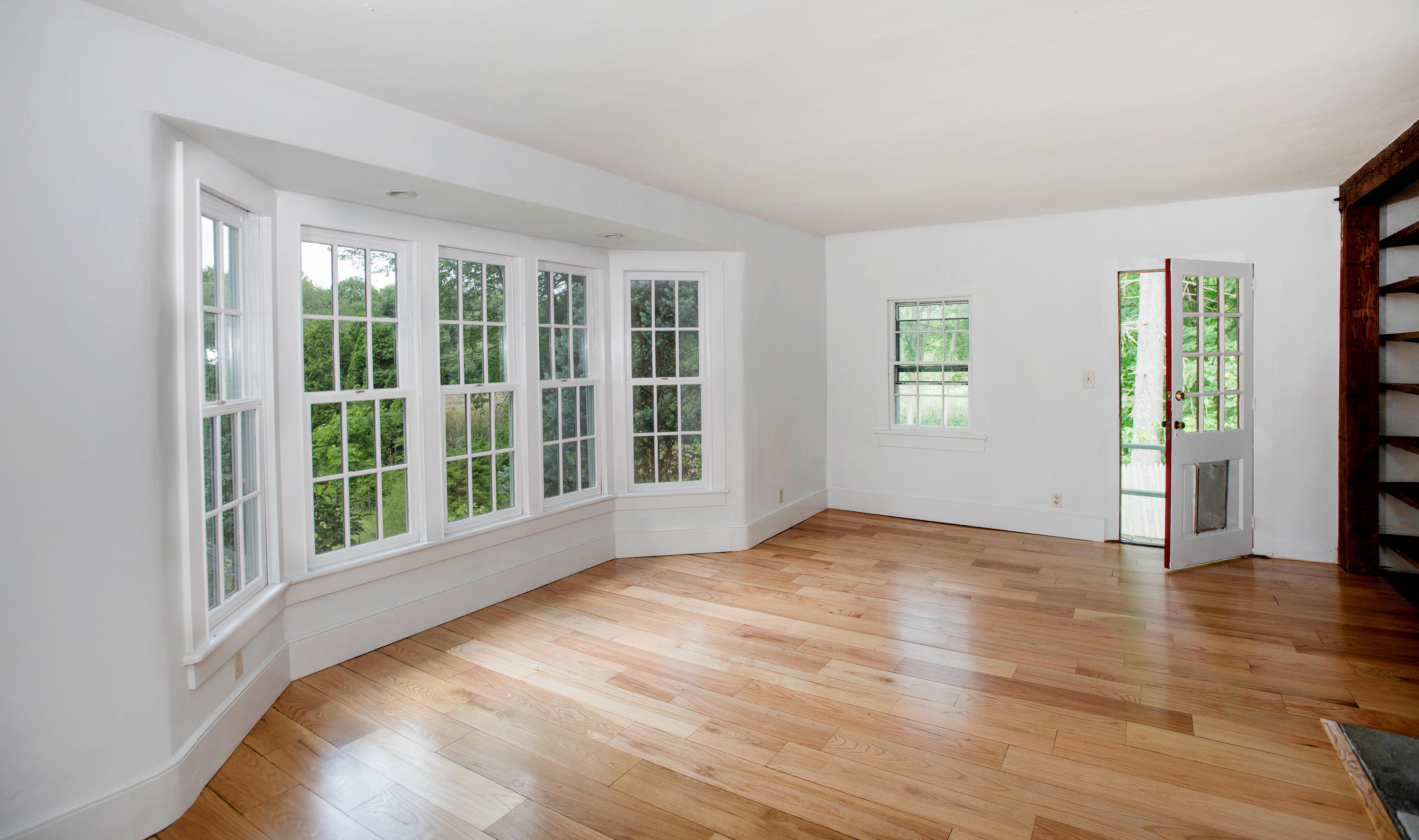 2884 Long Ridge Road Stamford, CT 06903 - Photo 11 of 20 a view of an empty room with wooden floor and a window