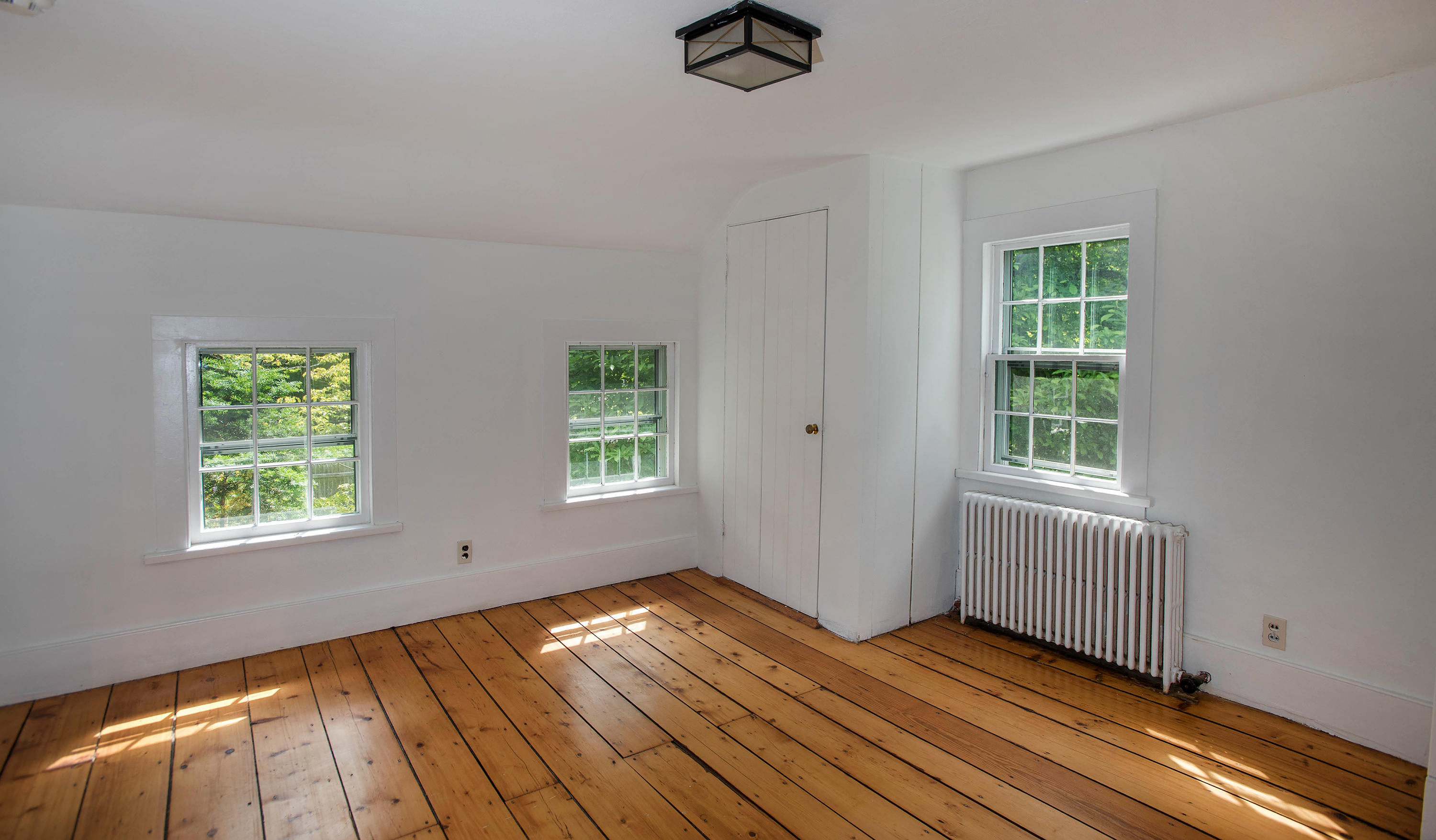 2884 Long Ridge Road Stamford, CT 06903 - Photo 15 of 20 wooden floor in an empty room with a window