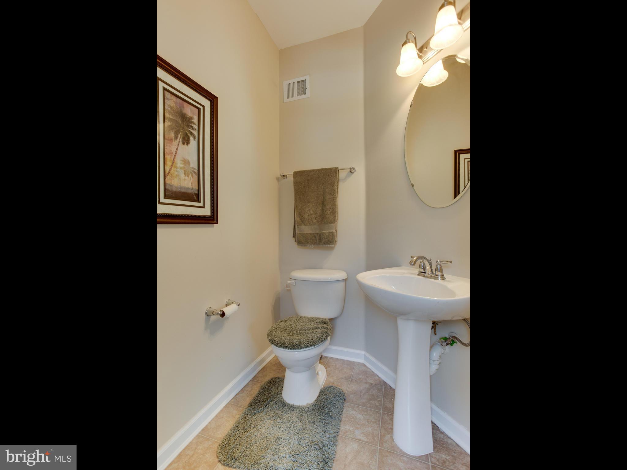 8022 Forest Ridge Drive, Unit 4 Chesapeake Beach, MD 20732 - Photo 9 of 32 Half Bath - Kitchen / Family Room Level