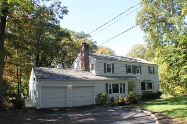 84 Hunting Ridge Road Stamford, CT 06903 - Photo 1 of 1 a view of a house with a yard