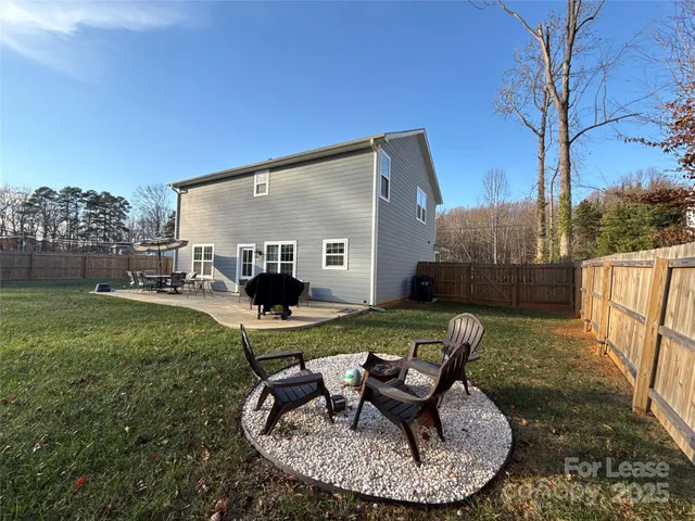 a view of a chair and table in the garden