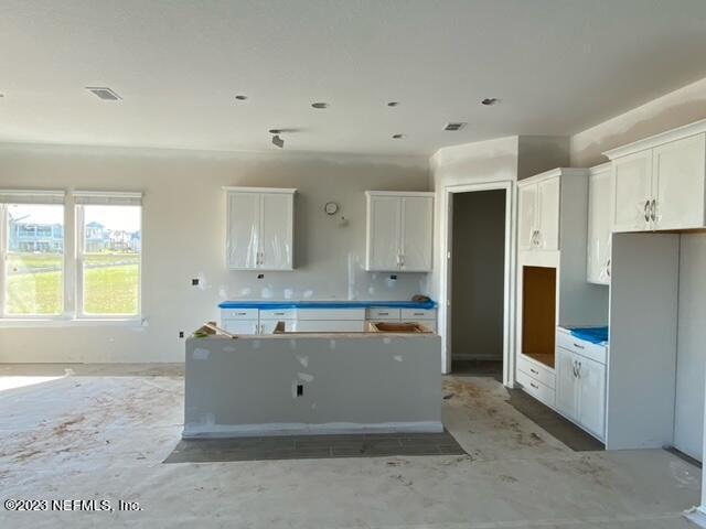 384 Rum Runner Way St. Johns, FL 32259 - Photo 4 of 21 a view of kitchen with stainless steel appliances kitchen island sink refrigerator and window