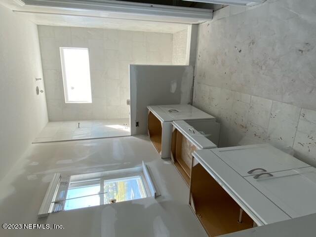 384 Rum Runner Way St. Johns, FL 32259 - Photo 6 of 21 a utility room with dryer and washer