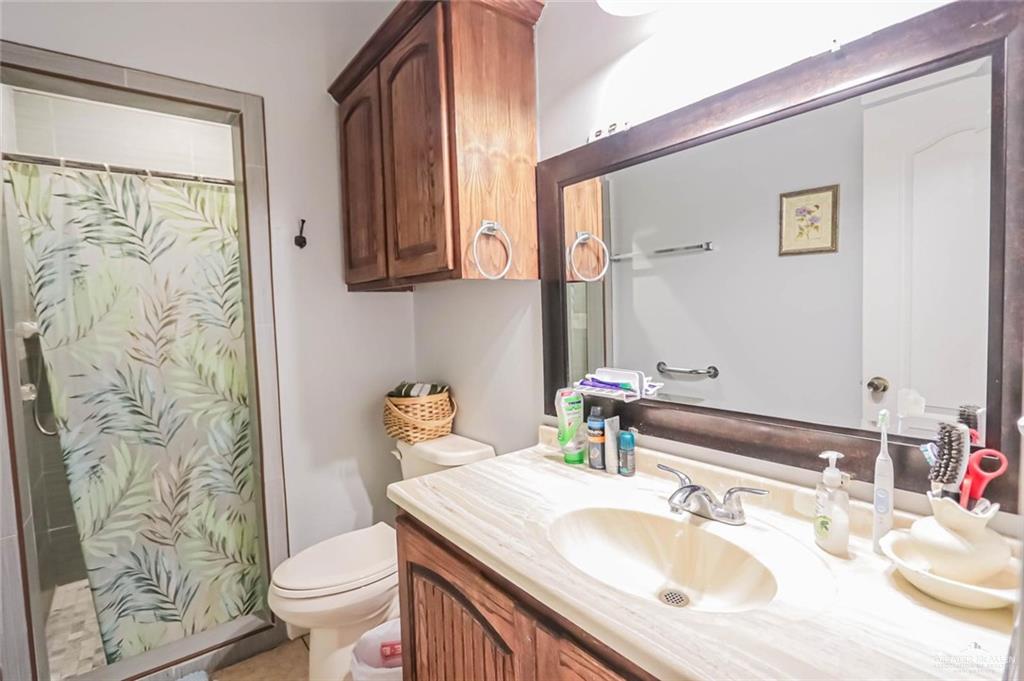 4701 Russell Circle Mission, TX 78574 - Photo 19 of 37 a bathroom with a sink toilet and shower