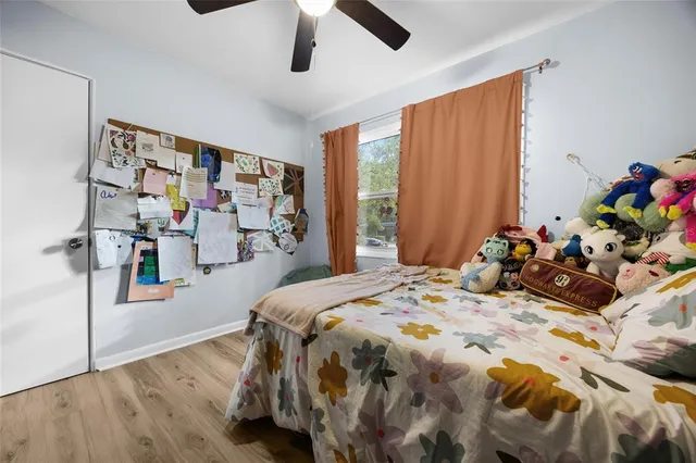 a bed room with a bed and a book shelf