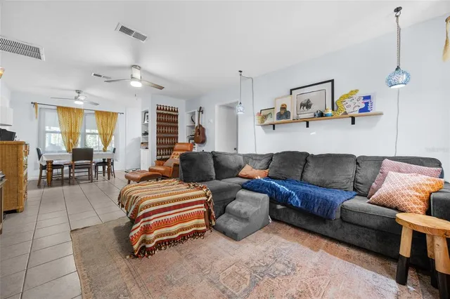 a bedroom with furniture and a chandelier