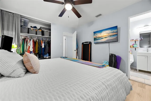 a bedroom with a bed and dresser