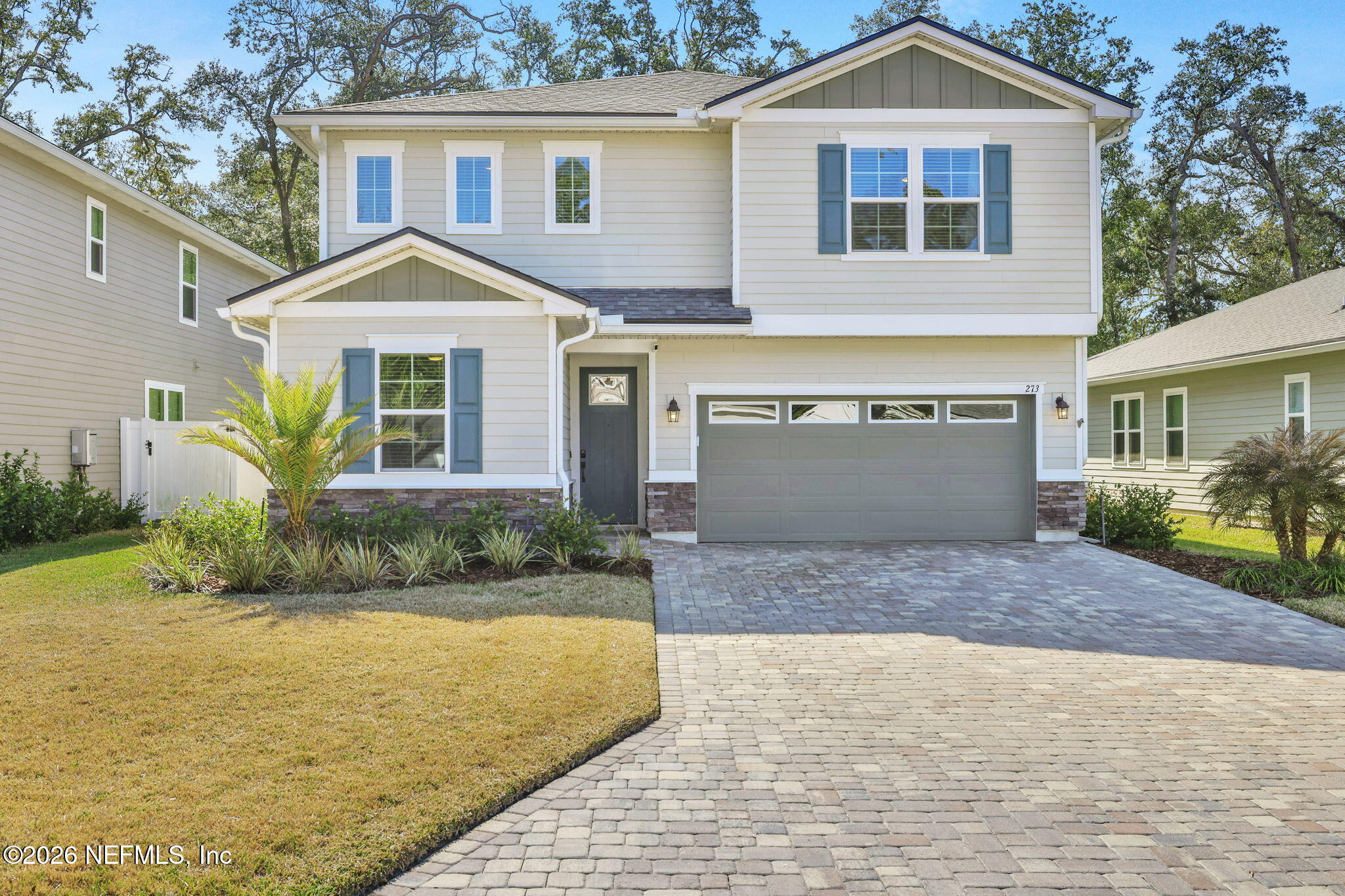 273 Little Bear Run St. Johns, FL 32259 - Photo 1 of 57 a front view of a house with a yard and garage