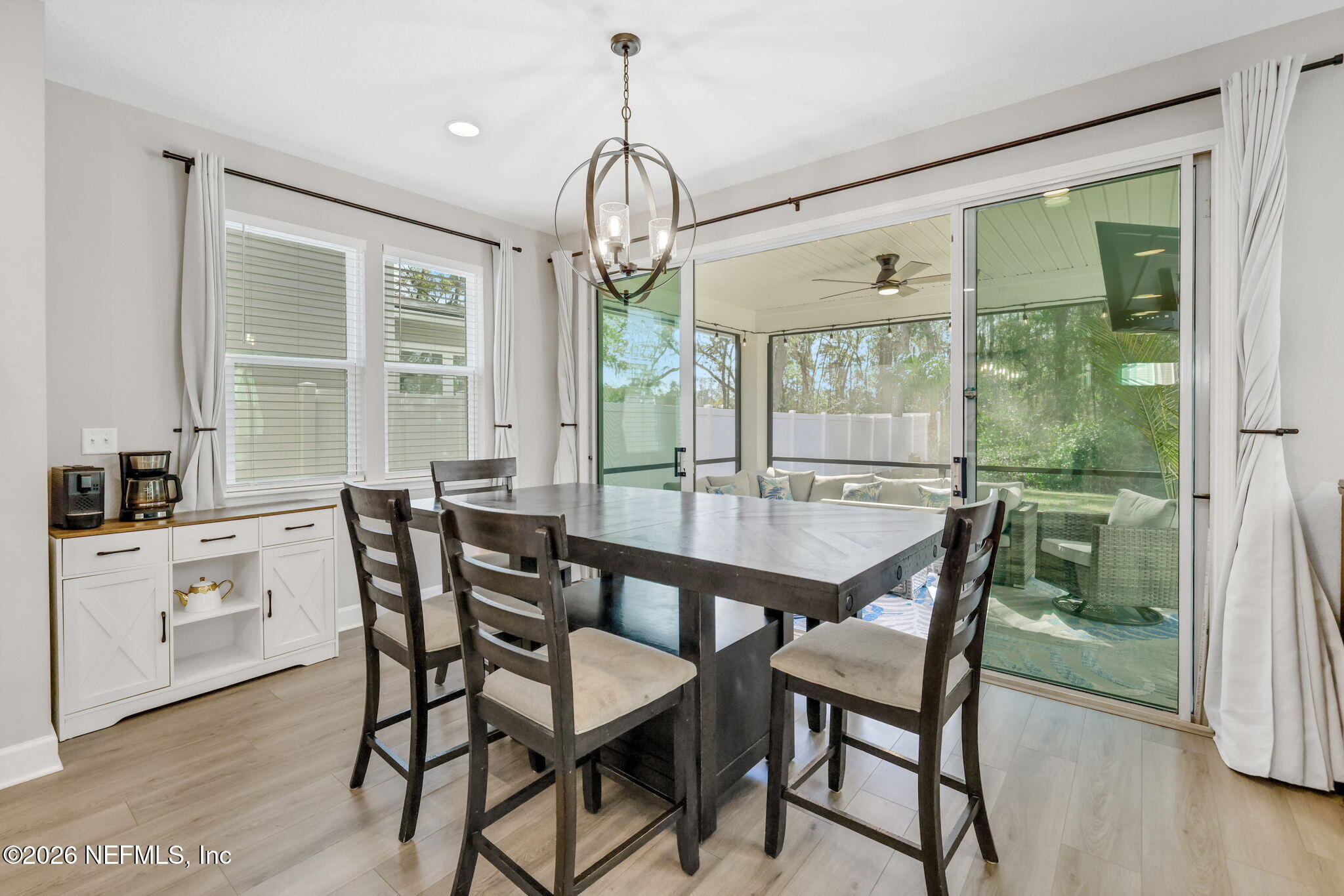 273 Little Bear Run St. Johns, FL 32259 - Photo 11 of 57 a dining room with furniture a chandelier and wooden floor