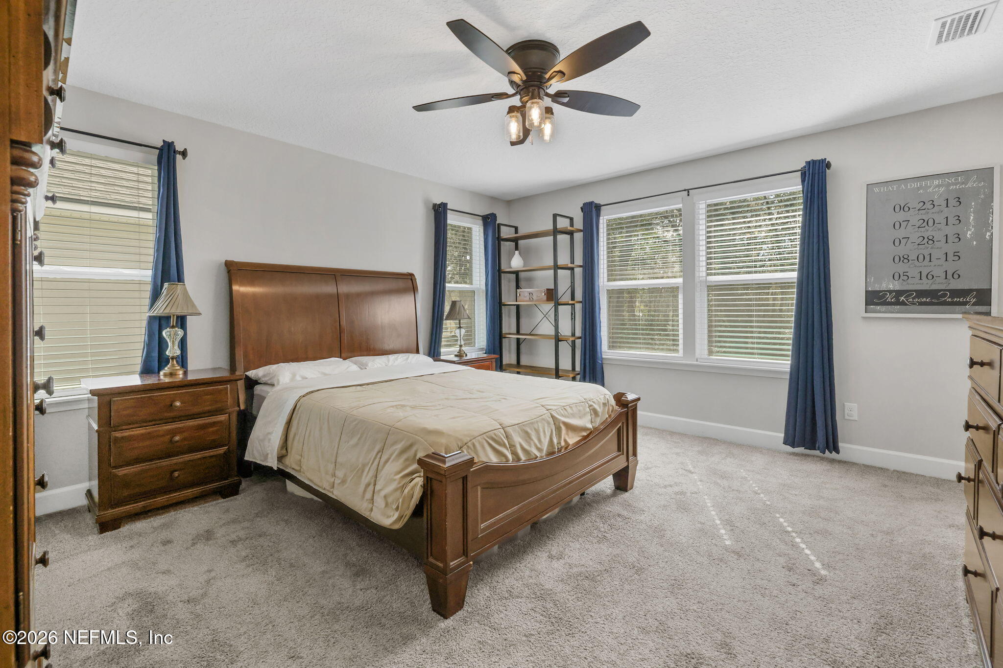 273 Little Bear Run St. Johns, FL 32259 - Photo 27 of 57 a bed sitting in a bedroom next to a window