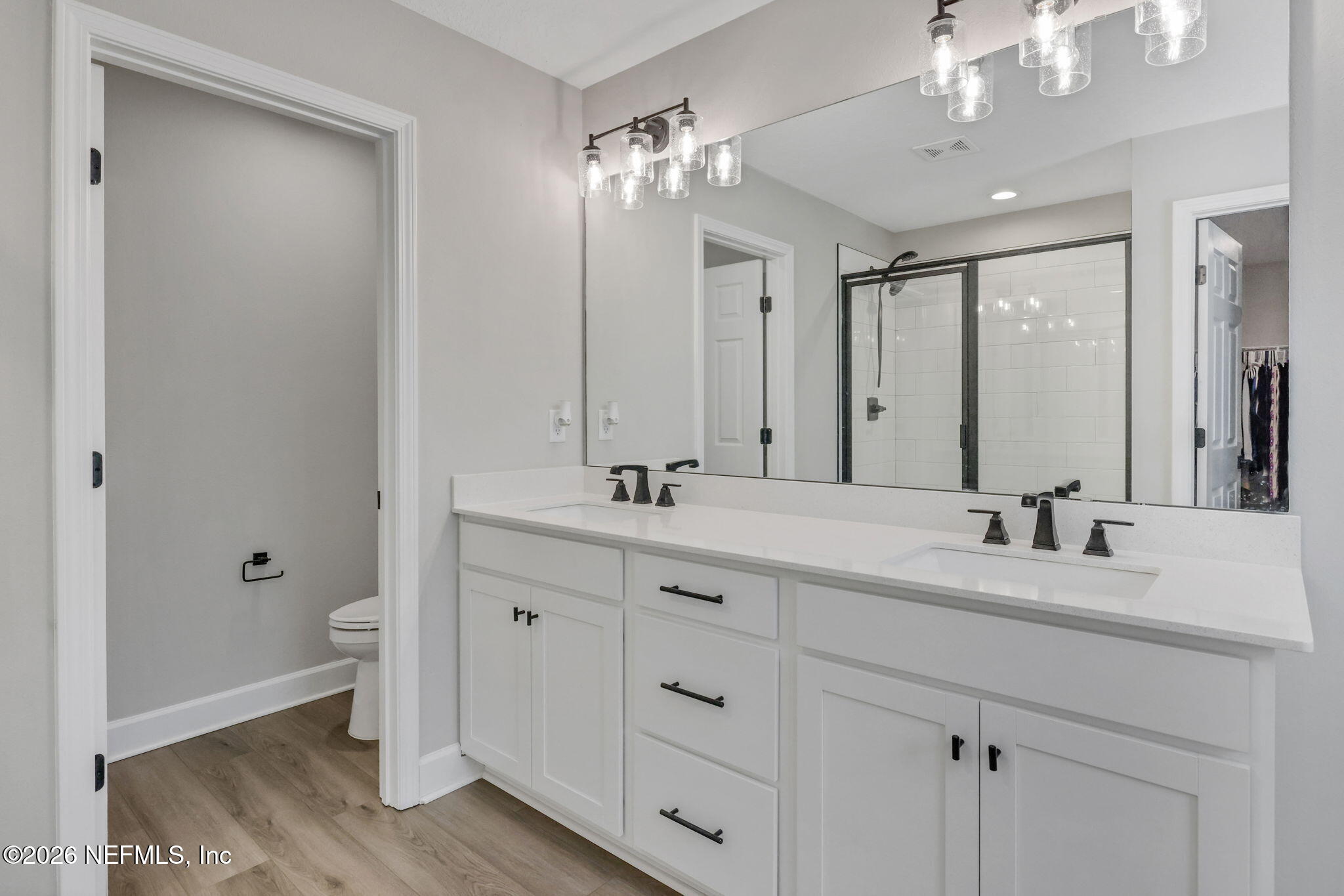 273 Little Bear Run St. Johns, FL 32259 - Photo 29 of 57 a bathroom with a double vanity sink and a mirror