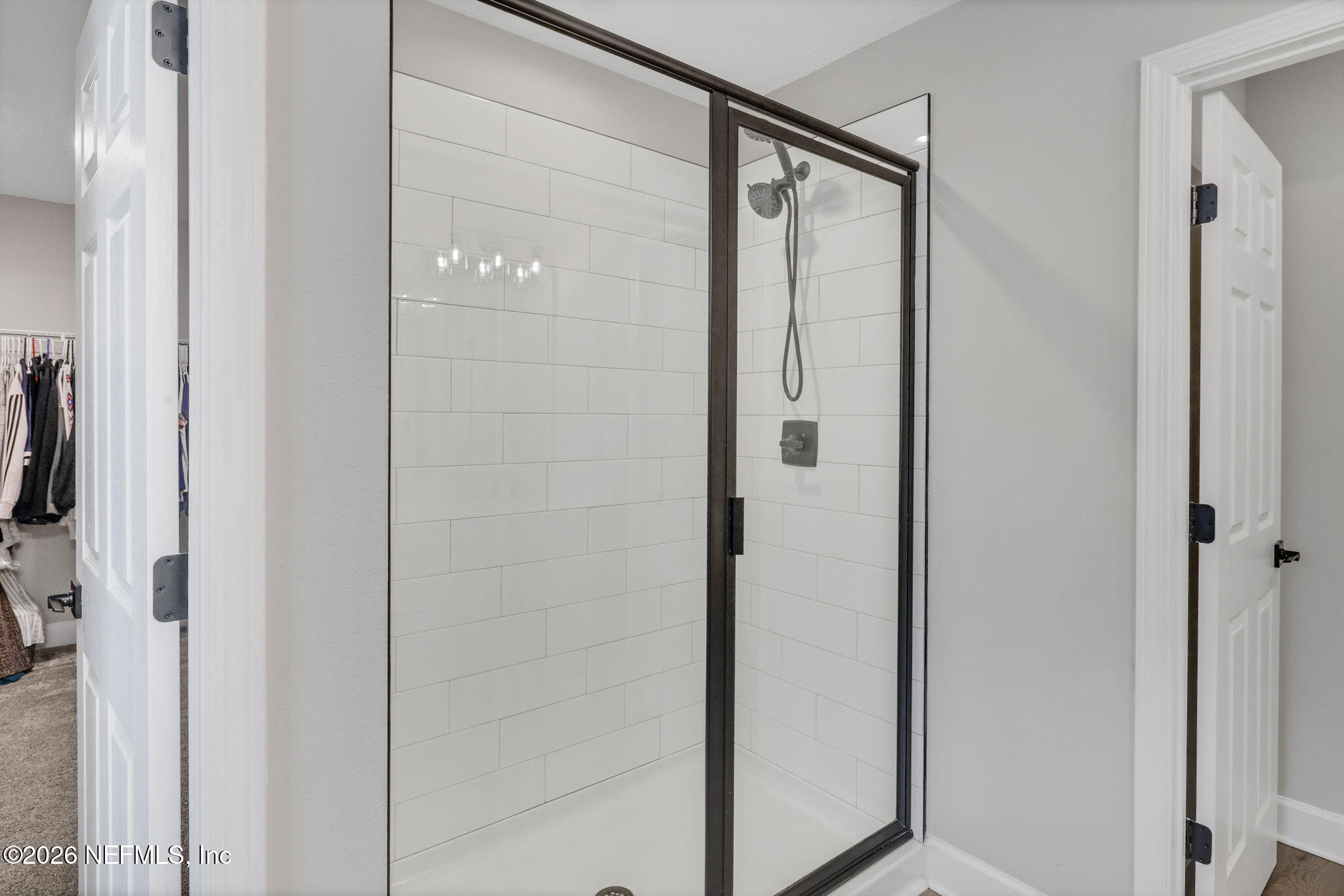 273 Little Bear Run St. Johns, FL 32259 - Photo 31 of 57 a bathroom with a glass shower door and a sink
