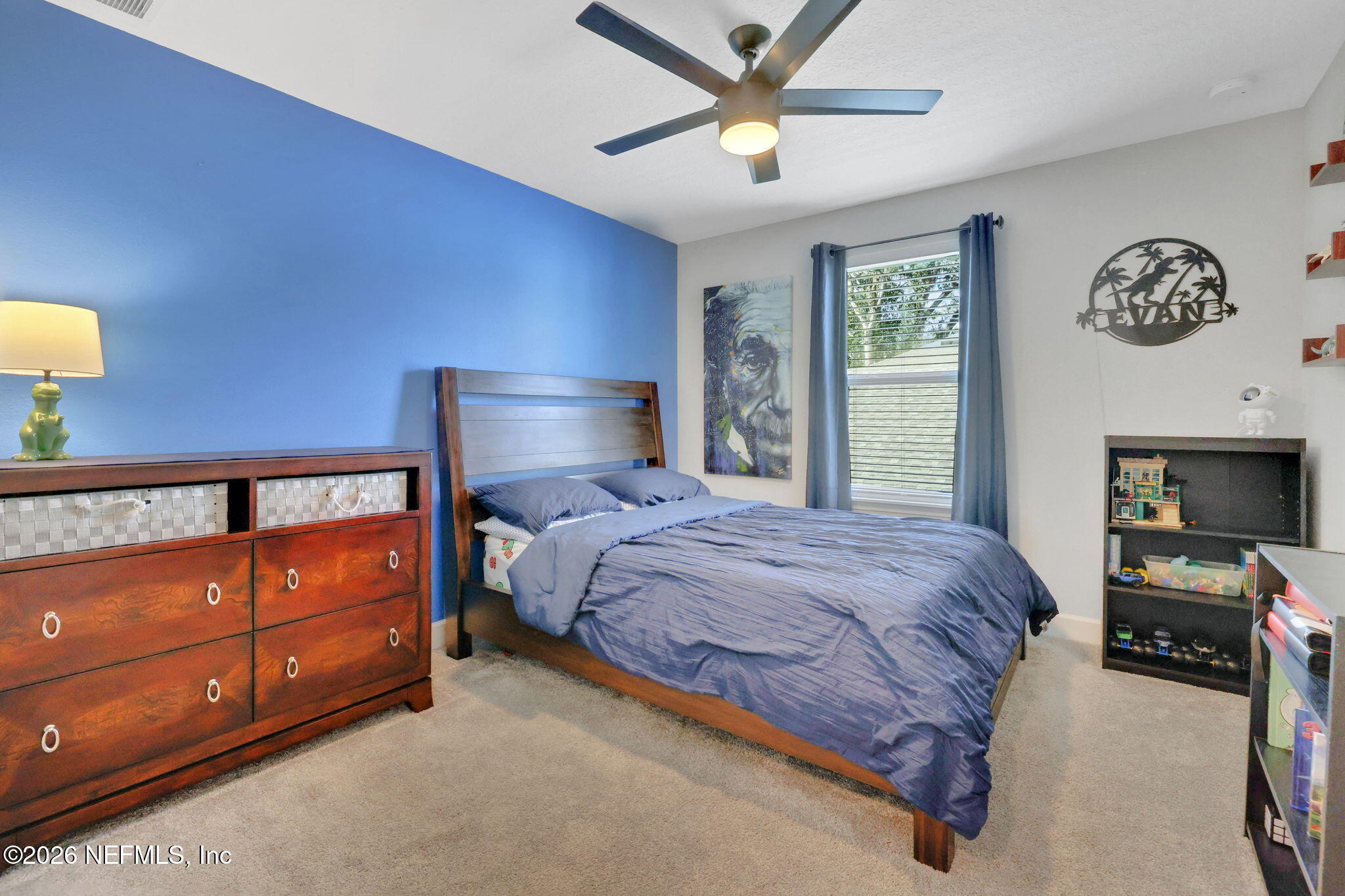 273 Little Bear Run St. Johns, FL 32259 - Photo 36 of 57 a bedroom with a bed and a chandelier