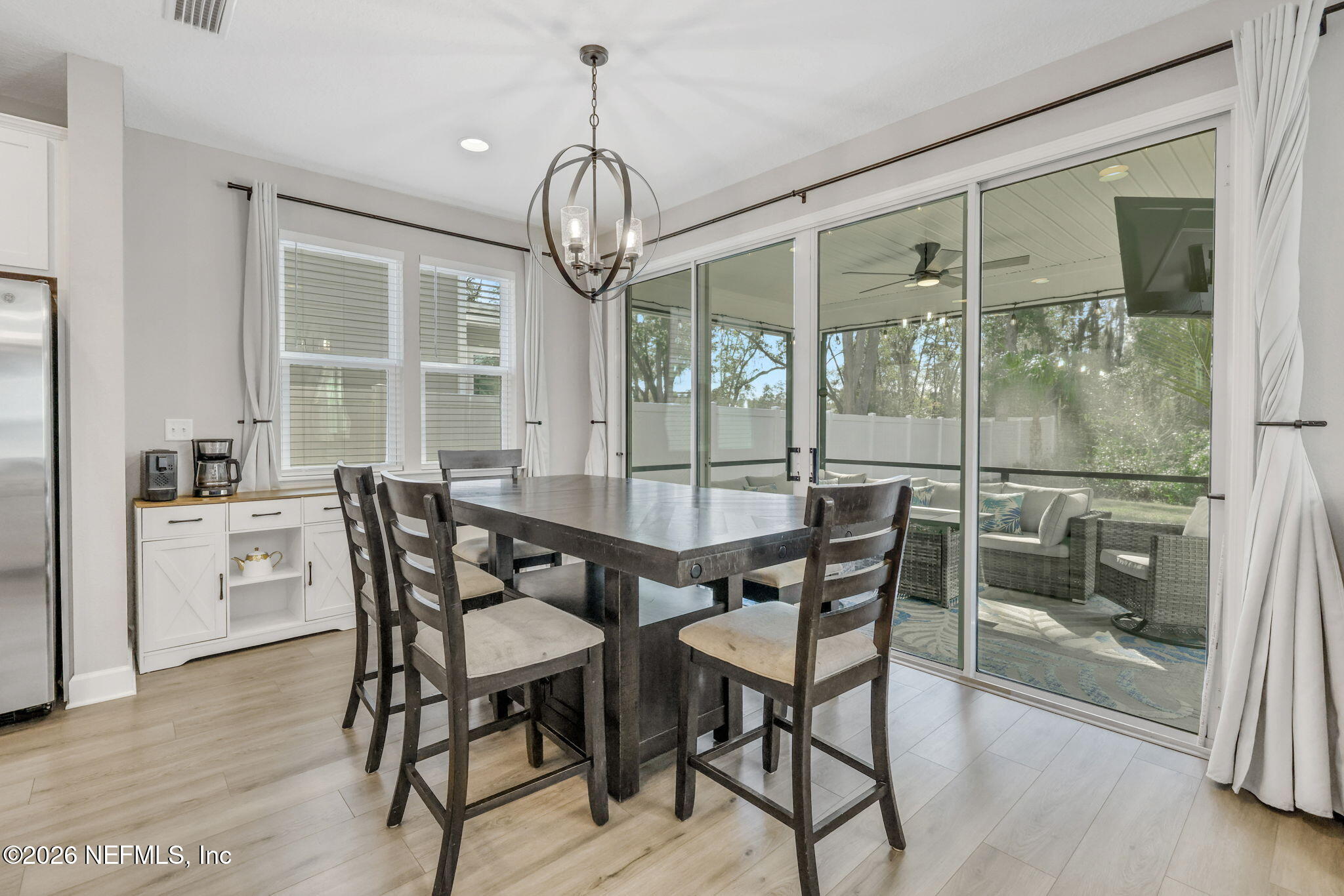 273 Little Bear Run St. Johns, FL 32259 - Photo 4 of 57 a view of a dining room with furniture wooden floor and chandelier