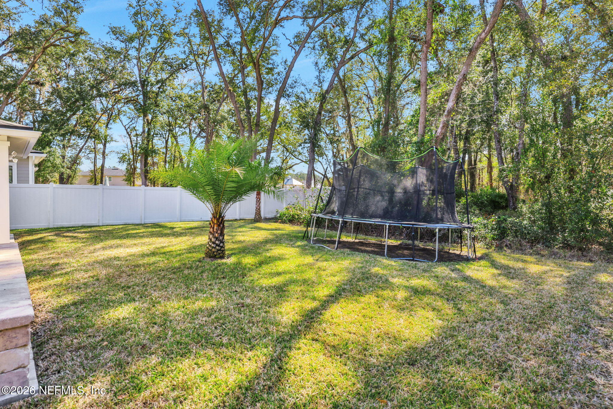 273 Little Bear Run St. Johns, FL 32259 - Photo 46 of 57 a view of a swimming pool with an outdoor seating and a yard