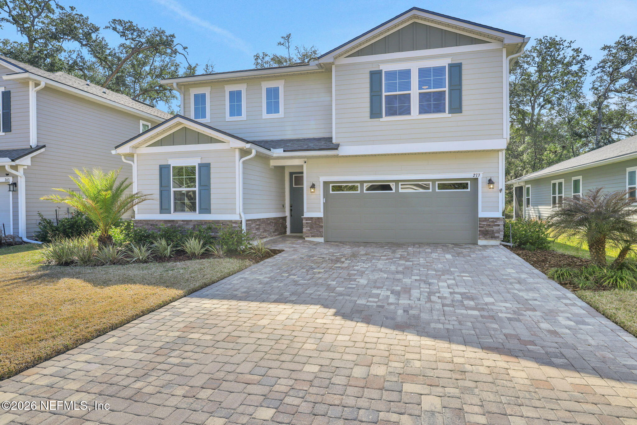 273 Little Bear Run St. Johns, FL 32259 - Photo 57 of 57 a front view of a house with a yard and garage